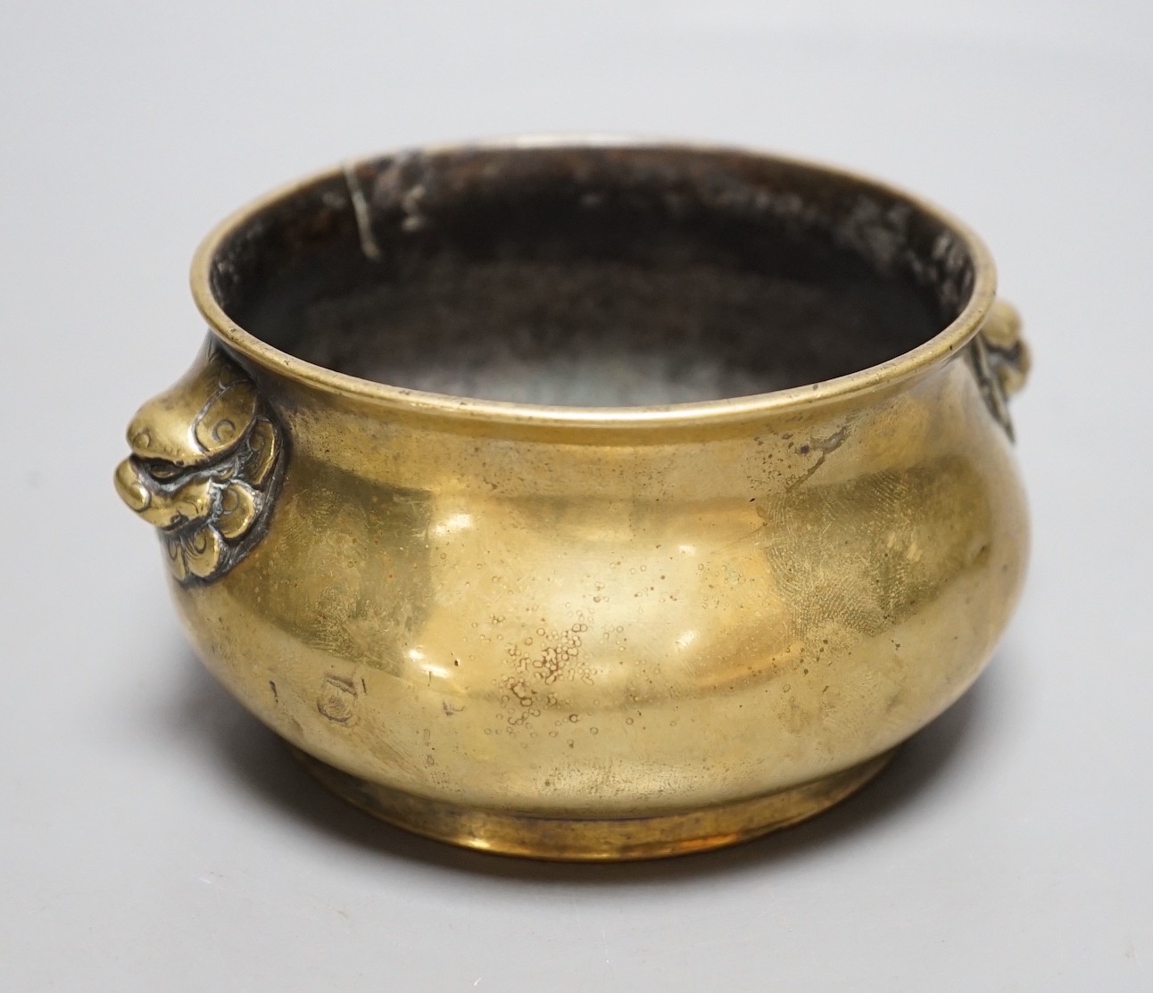 A Chinese bronze censer, Xuande mark, Qing period, 12cm handle to handle